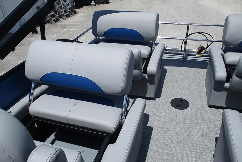 Slide: The Image of 2026 Bentley Pontoons Legacy 220 Quad Swingback interior with gray and blue seating. - 20