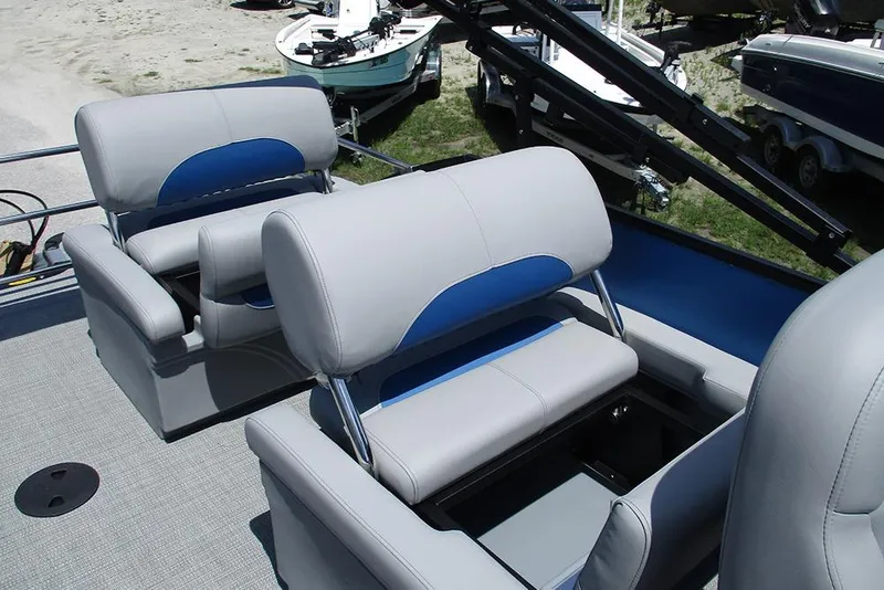 Slide: The Image of 2026 Bentley Pontoons Legacy 220 Quad Swingback interior with plush seating and storage compartments. - 21