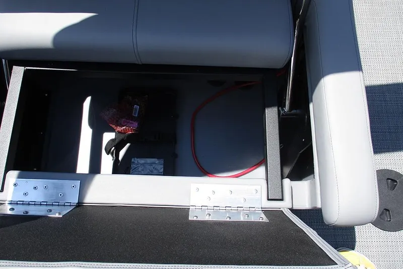 Slide: The Image of Open storage compartment in 2026 Bentley Pontoons Legacy 220 Quad Swingback boat. - 24