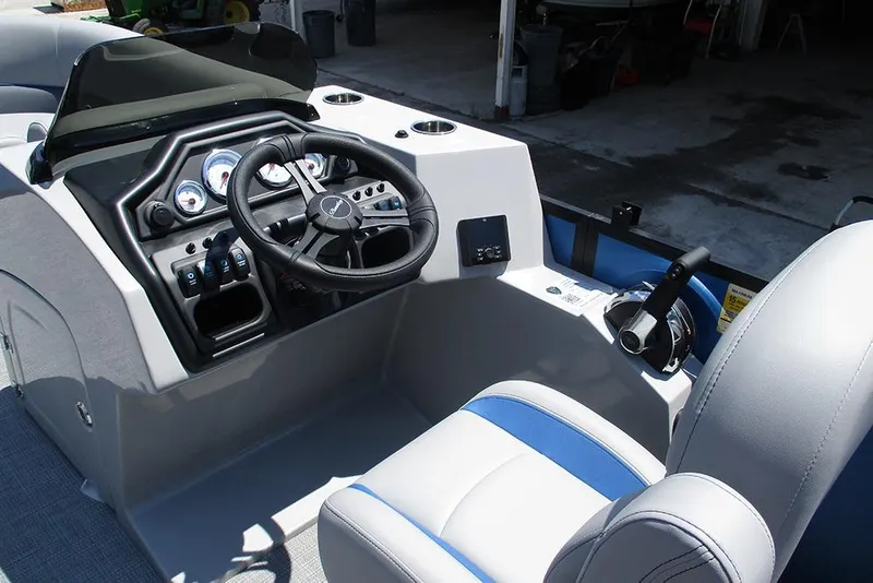 Slide: The Image of 2026 Bentley Pontoons Legacy 220 Quad Swingback helm with steering wheel and controls. - 31