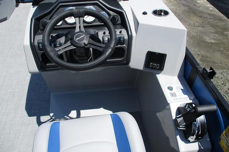 Slide: The Image of 2026 Bentley Pontoons Legacy 220 Quad Swingback steering console with modern controls and cup holder. - 32