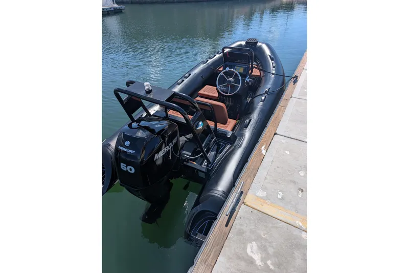 Slide: The Image of 2026 Tide Craft Custom Black & Tan Catalina 13 boat docked with Mercury 60 engine. - 10