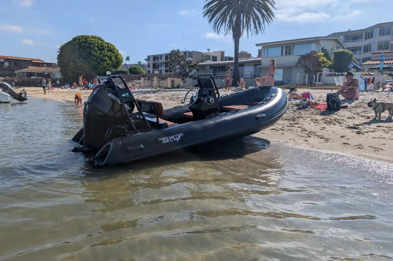Slide: The Image of 2026 Tide Craft Custom Black & Tan Catalina 13 boat on a sunny beach. - 4