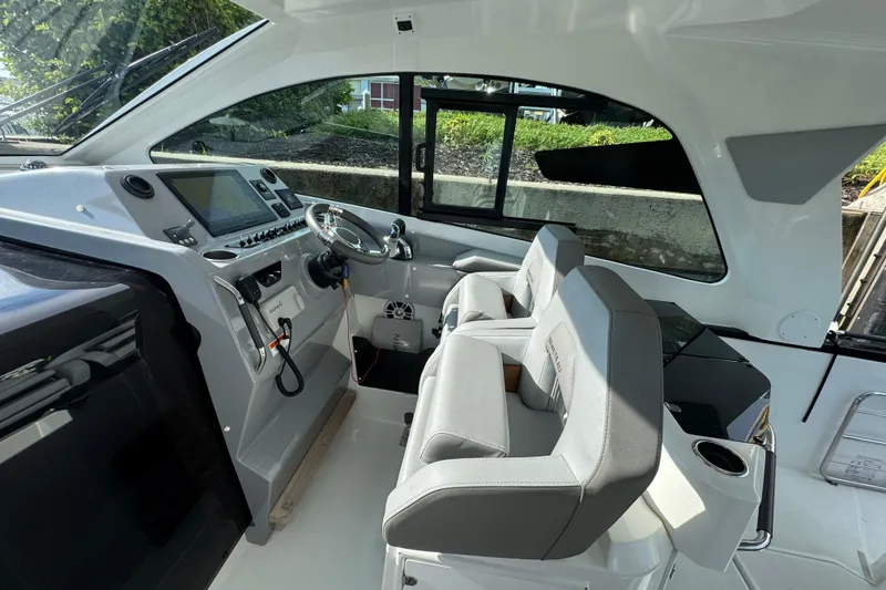 Slide: The Image of Interior of 2022 Beneteau Gran Turismo 32 yacht with modern helm and seating. - 14