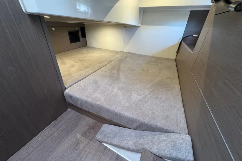 Slide: The Image of Interior cabin of 2022 Beneteau Gran Turismo 32 with modern design and comfortable bedding. - 17