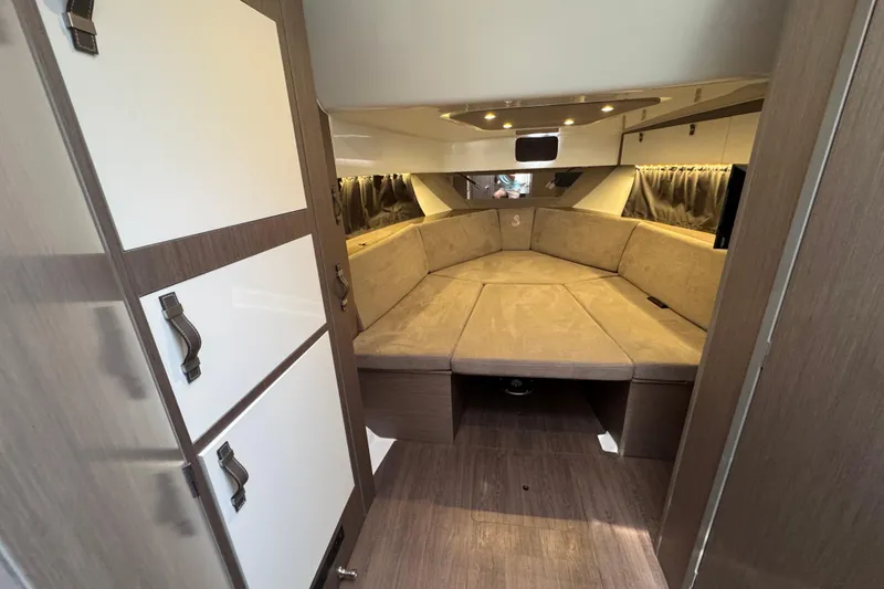 Slide: The Image of Interior of 2022 Beneteau Gran Turismo 32 yacht, featuring cozy seating and modern design. - 19