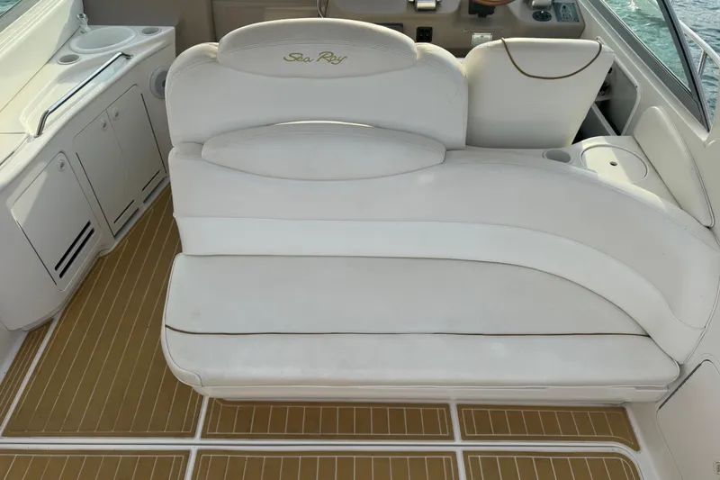 Slide: The Image of Luxury seating on a 2000 Sea Ray 340 Sundancer boat with elegant white upholstery. - 11
