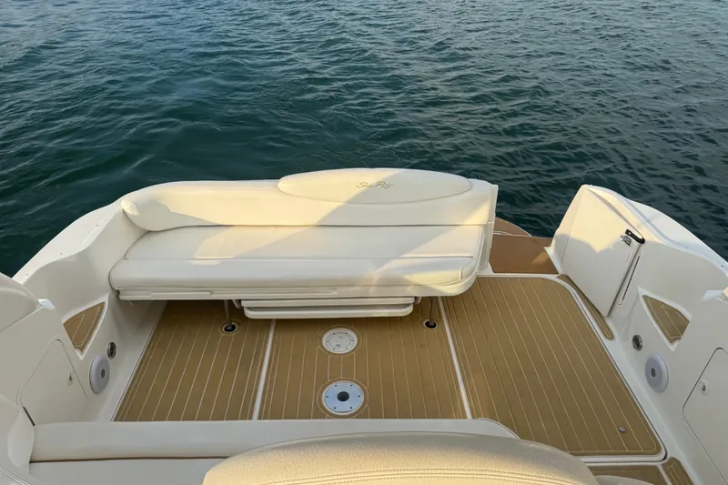 Slide: The Image of Rear deck of 2000 Sea Ray 340 Sundancer boat with seating, overlooking water. - 12