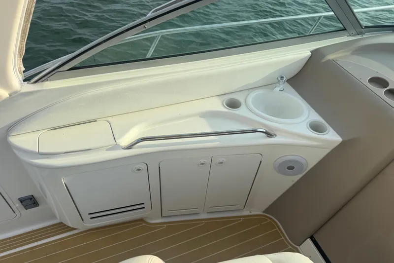Slide: The Image of 2000 Sea Ray 340 Sundancer boat interior with sink and storage cabinets. - 15