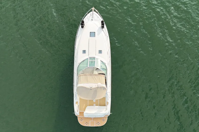 Slide: The Image of Top view of a 2000 Sea Ray 340 Sundancer yacht on calm water. - 9