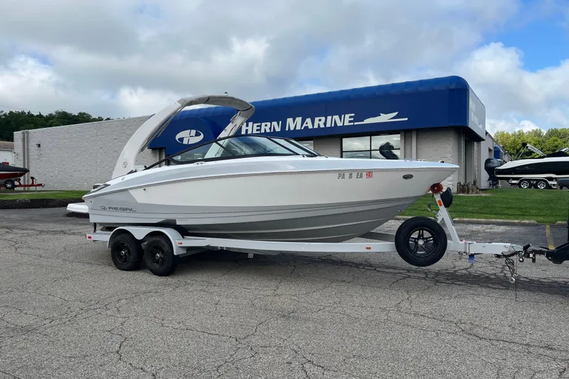 The Image of 2021 Regal 2300 Bowrider boat on trailer outside Hern Marine dealership. - 0