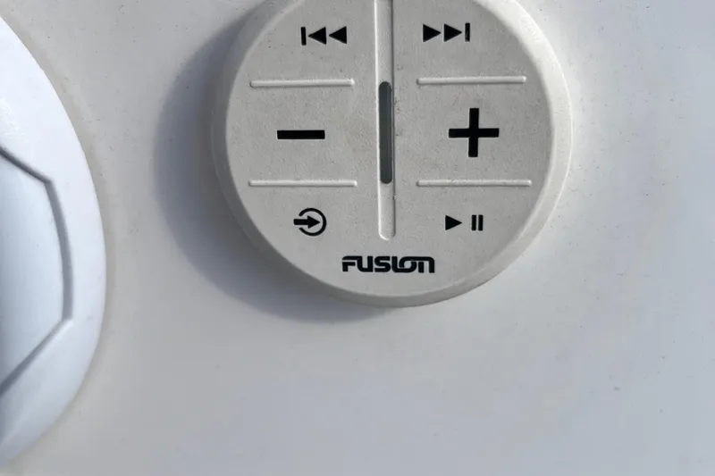 Slide: The Image of Close-up of Fusion audio control panel on 2021 Regal 2300 Bowrider boat. - 16
