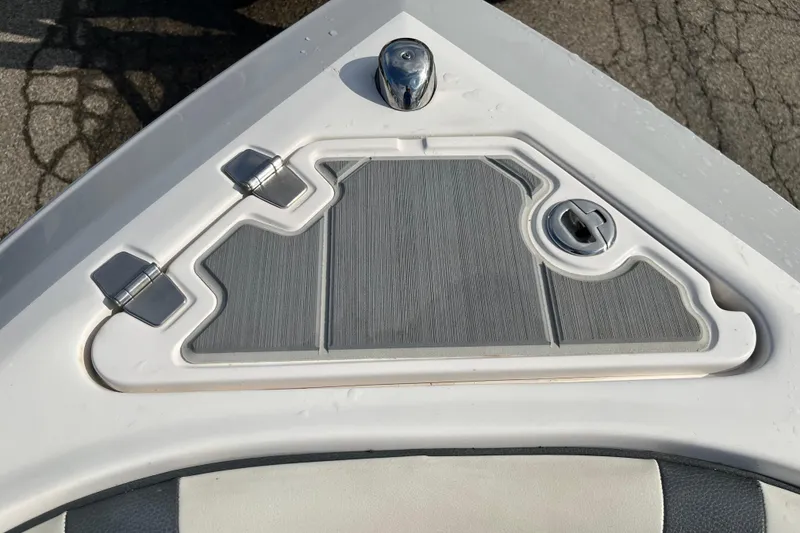 Slide: The Image of Bow of 2021 Regal 2300 Bowrider with storage compartment and latch. - 2