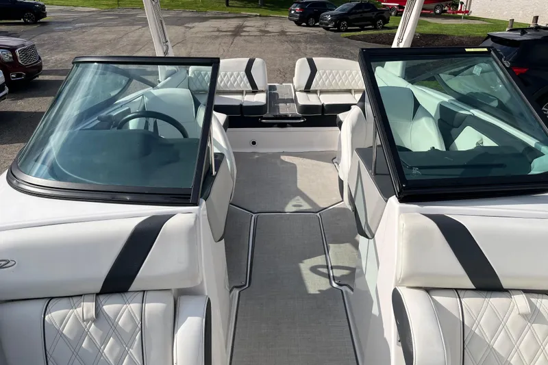 Slide: The Image of 2021 Regal 2300 Bowrider boat interior with white seating and windshield. - 3