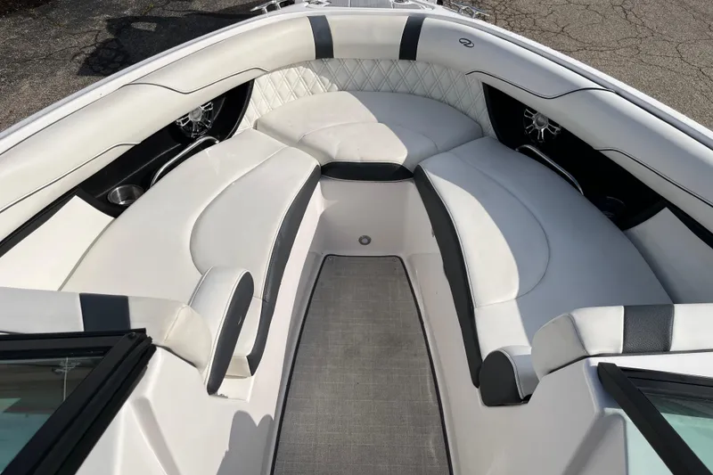 Slide: The Image of 2021 Regal 2300 Bowrider interior with white cushioned seating and modern design. - 4