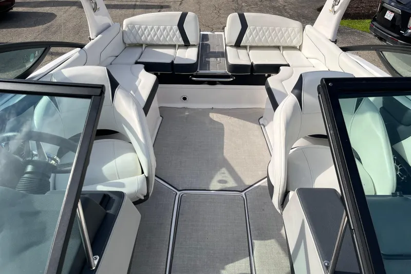 Slide: The Image of 2021 Regal 2300 Bowrider interior with white seating and modern design. - 6