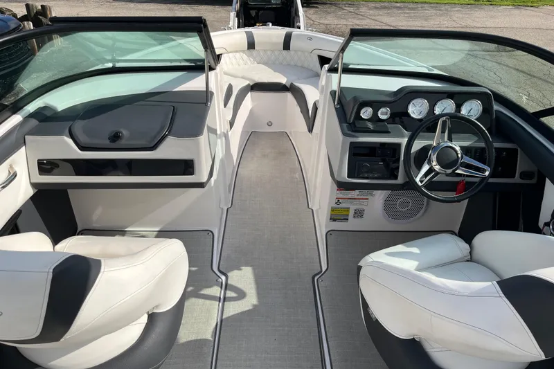 Slide: The Image of 2021 Regal 2300 Bowrider interior with modern dashboard and comfortable seating. - 7