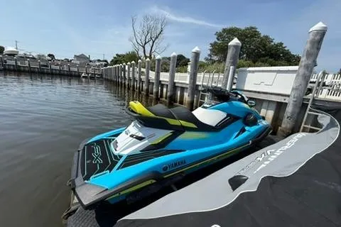 Slide: The Image of 2023 Yamaha WaveRunner FX Cruiser HO docked by a marina. - 1