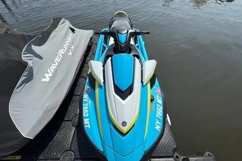 Slide: The Image of 2023 Yamaha WaveRunner FX Cruiser HO in blue, docked on water. - 3