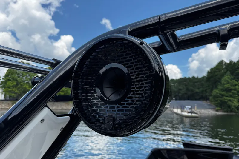 Slide: The Image of 2024 Centurion Fi23 boat speaker with sleek design on a sunny lake. - 14