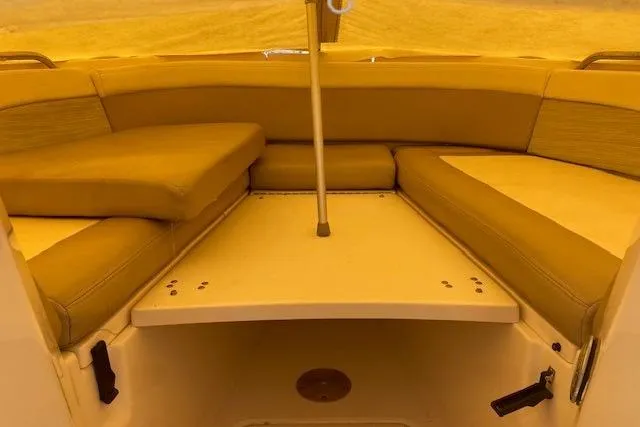 Slide: The Image of 2014 Grady-White Freedom 285 boat interior with cushioned seating area. - 10