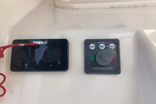 Slide: The Image of Control panel of a 2014 Grady-White Freedom 285 boat with Yamaha and Side-Power systems. - 11