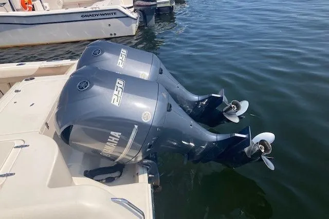 Slide: The Image of 2014 Grady-White Freedom 285 boat with twin Yamaha 250 outboard engines on water. - 3
