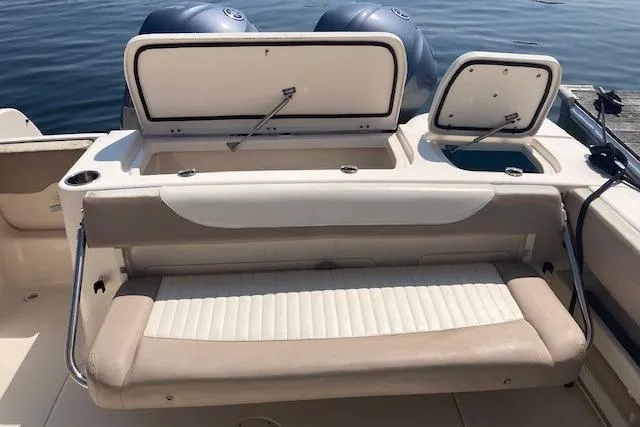 Slide: The Image of 2014 Grady-White Freedom 285 boat with open storage compartments and seating. - 7