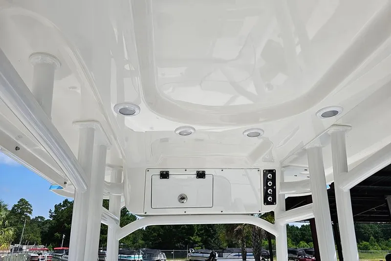 Slide: The Image of 2026 Sea Pro 230 Bay boat interior ceiling with built-in lights and storage. - 15