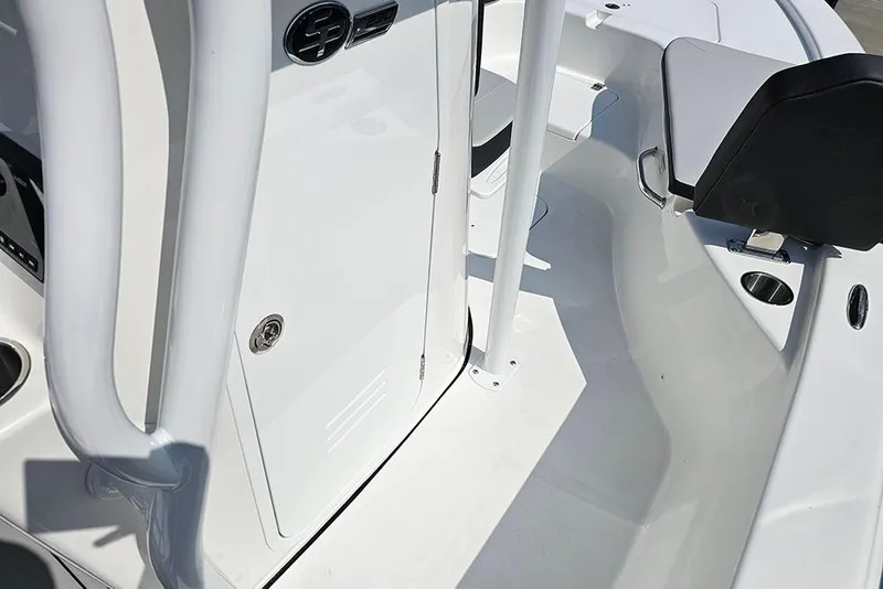 Slide: The Image of 2026 Sea Pro 230 Bay boat interior, featuring sleek white design and seating area. - 21