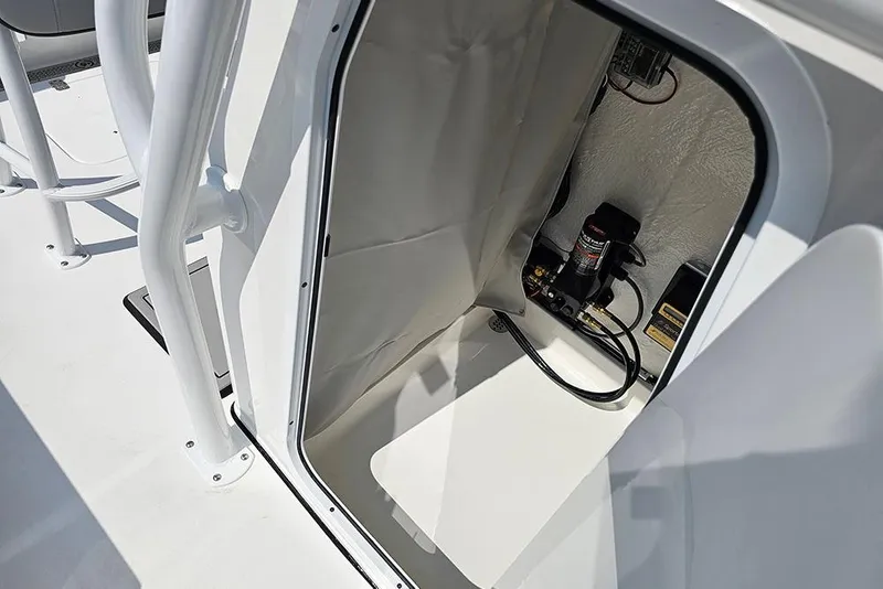Slide: The Image of 2026 Sea Pro 230 Bay boat storage compartment with equipment and wiring. - 23