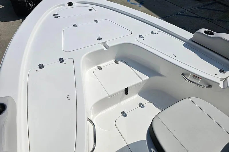 Slide: The Image of 2026 Sea Pro 230 Bay boat interior with storage compartments and seating. - 25
