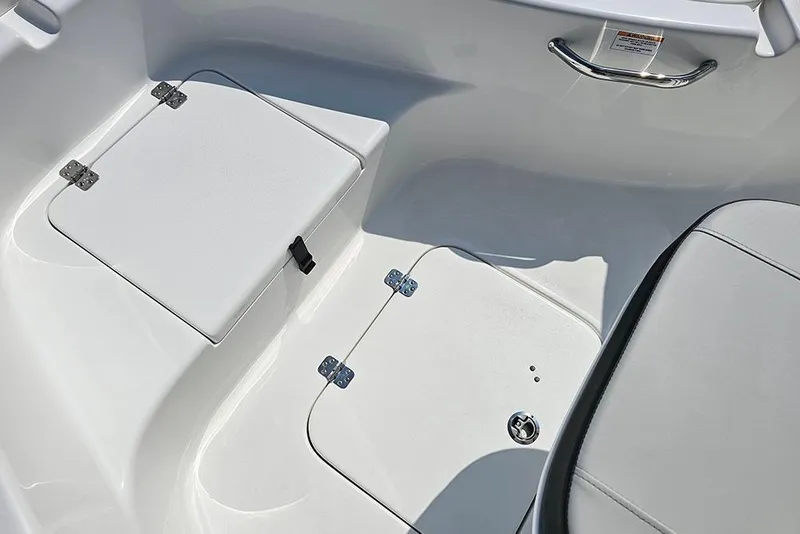 Slide: The Image of 2026 Sea Pro 230 Bay boat interior with storage compartments and seating. - 27