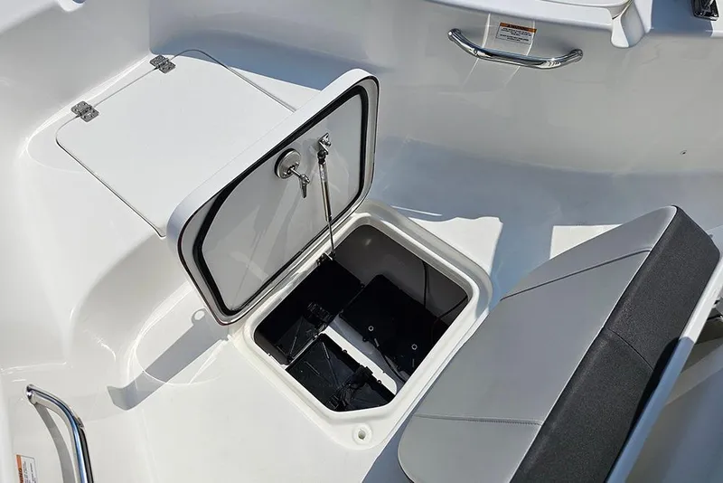 Slide: The Image of 2026 Sea Pro 230 Bay boat storage compartment with open hatch and seating. - 29