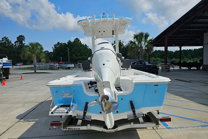 Slide: The Image of 2026 Sea Pro 230 Bay boat with outboard motor in a parking lot. - 7