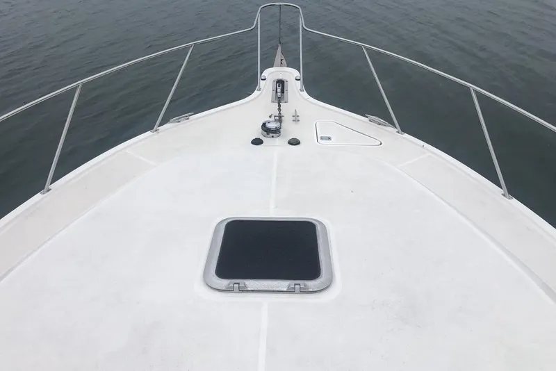 Slide: The Image of Bow view of 1998 Tiara Yachts 3700 Open on calm water. - 33