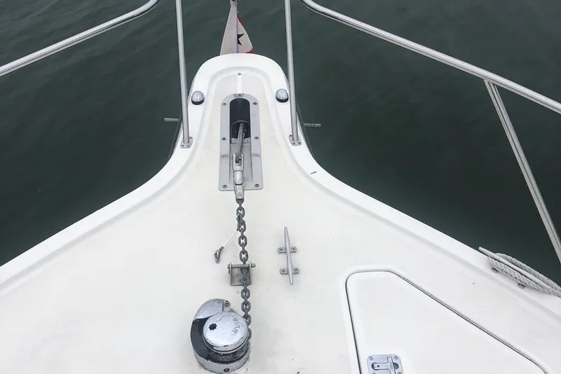 Slide: The Image of Bow view of 1998 Tiara Yachts 3700 Open with anchor chain and railing. - 34