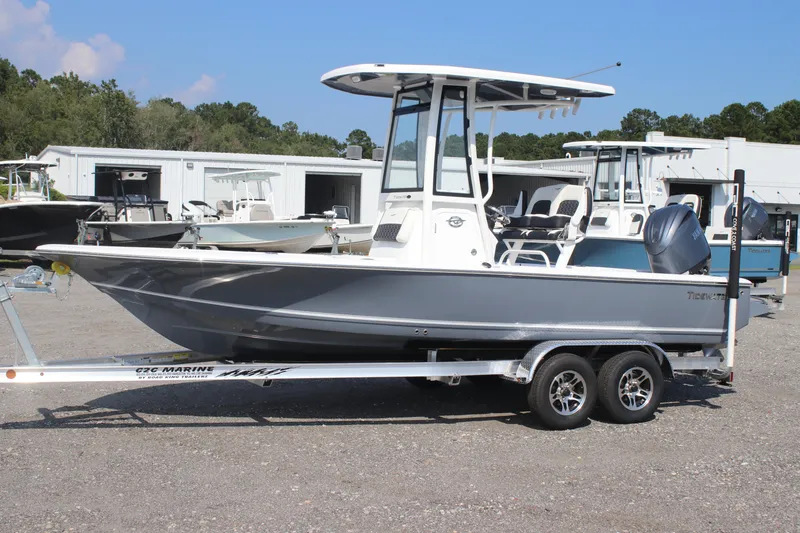 The Image of 2026 Tidewater 2110 Bay Max boat on trailer, parked outdoors. - 0