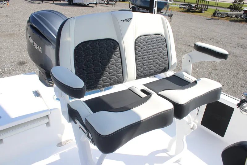 Slide: The Image of 2026 Tidewater 2110 Bay Max boat seating with Yamaha engine in outdoor setting. - 10