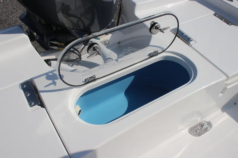 Slide: The Image of 2026 Tidewater 2110 Bay Max boat with open livewell and clear lid. - 12