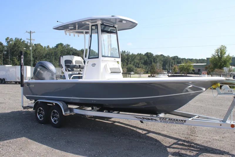 Slide: The Image of 2026 Tidewater 2110 Bay Max boat on trailer, parked outdoors. - 3
