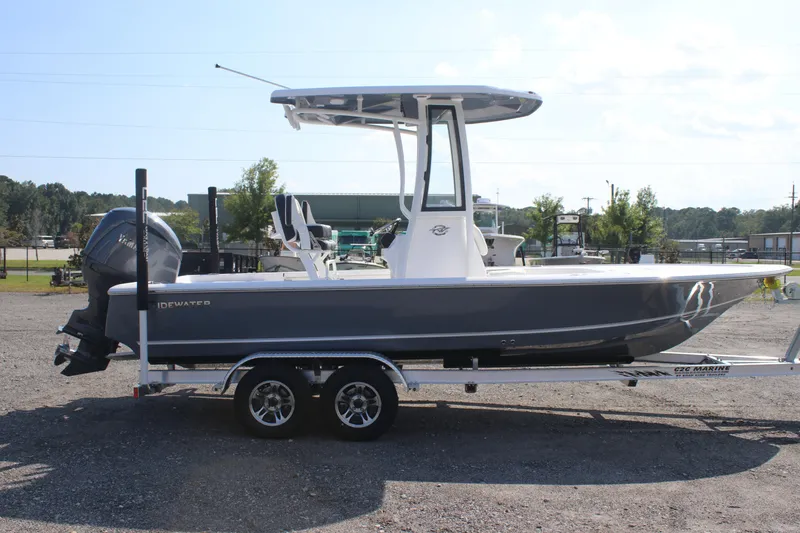 Slide: The Image of 2026 Tidewater 2110 Bay Max boat on trailer, side view, outdoors. - 4