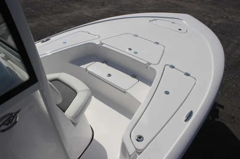 Slide: The Image of 2026 Tidewater 2110 Bay Max boat interior with seating and storage compartments. - 5