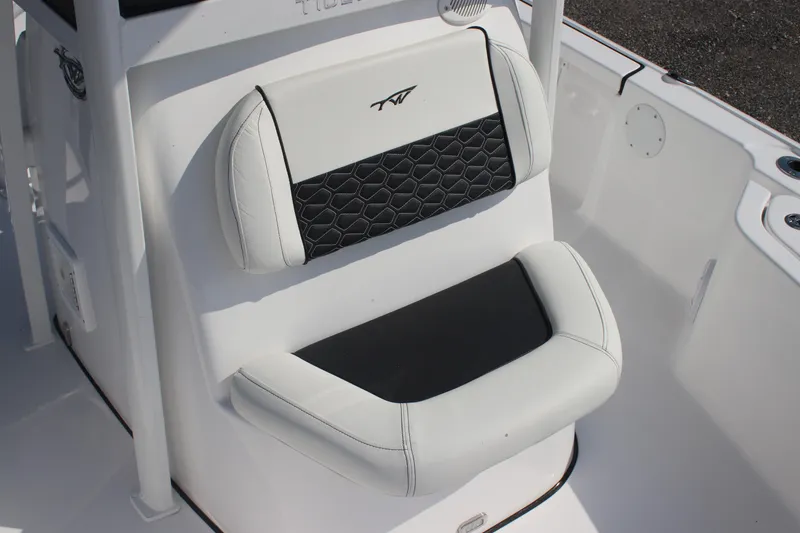 Slide: The Image of 2026 Tidewater 2110 Bay Max boat seat with black and white cushioned design. - 8