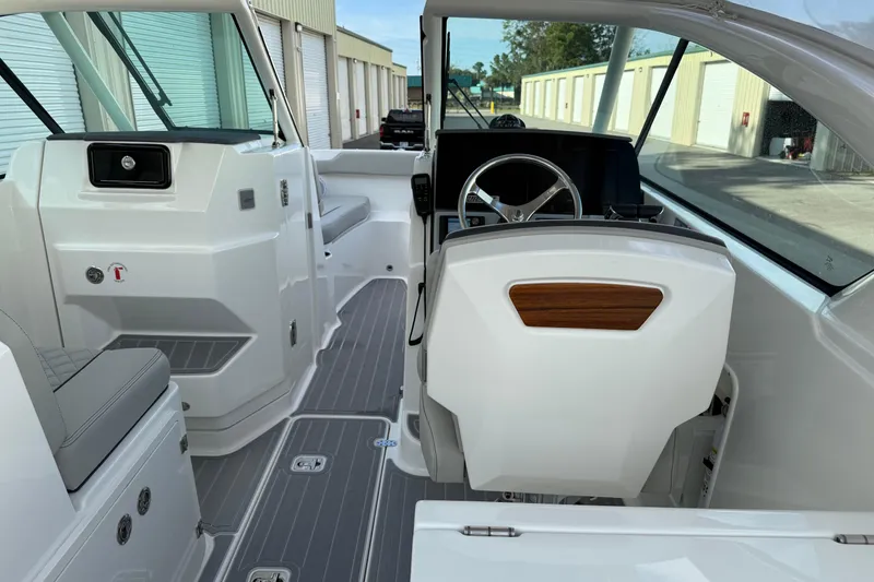 Slide: The Image of 2024 Pursuit DC 266 Dual Console interior with sleek design and modern controls. - 16