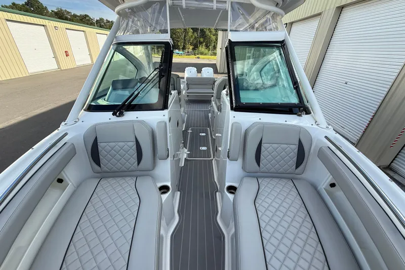 Slide: The Image of 2024 Pursuit DC 266 Dual Console boat interior with luxurious seating and modern design. - 29