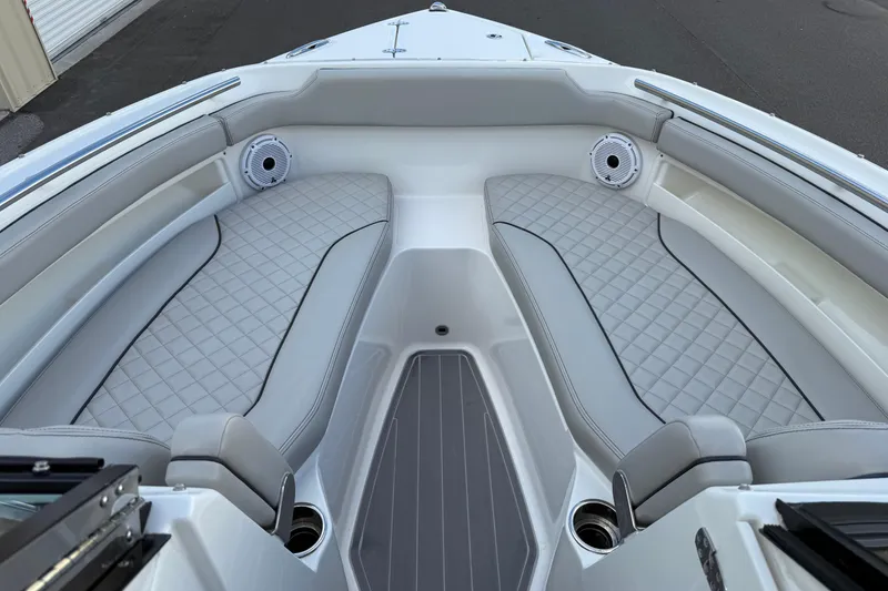 Slide: The Image of 2024 Pursuit DC 266 Dual Console boat interior with luxurious seating and speakers. - 32