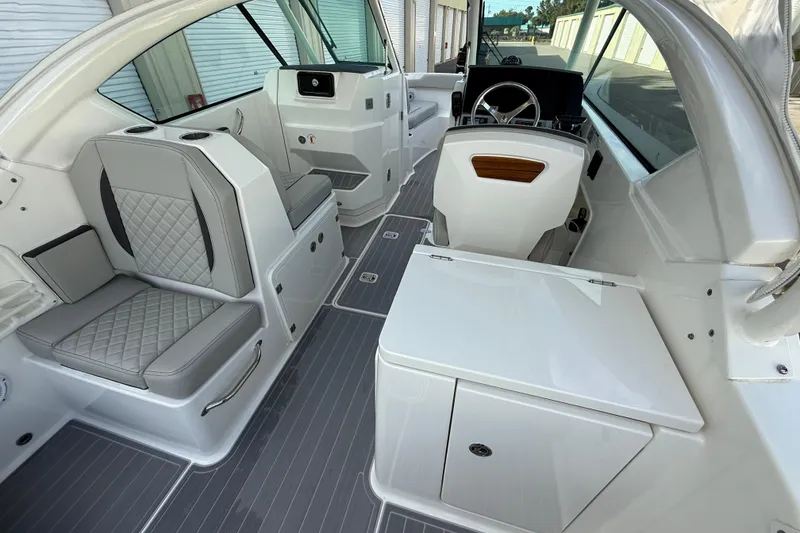 Slide: The Image of 2024 Pursuit DC 266 Dual Console interior with sleek seating and modern dashboard design. - 7