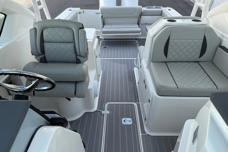 Slide: The Image of 2024 Pursuit DC 266 Dual Console interior with luxurious seating and modern design. - 8