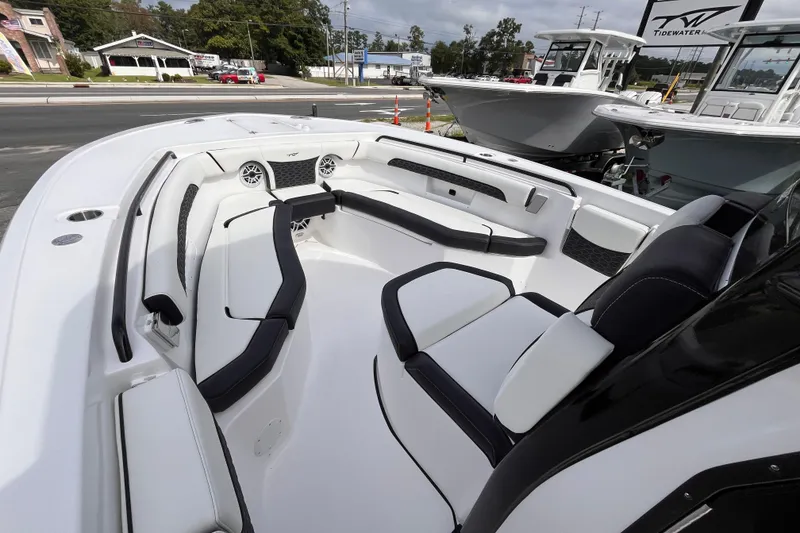 Slide: The Image of 2026 Tidewater 256 CC Adventure boat interior with sleek seating and modern design. - 11